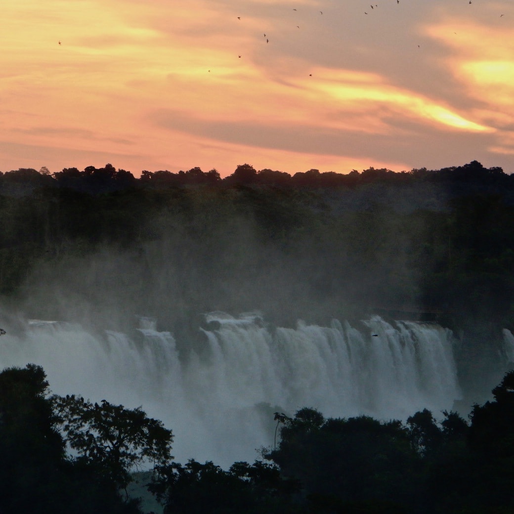 Sunset at Iguazu Falls, Brazil Image of sunset over the falls
