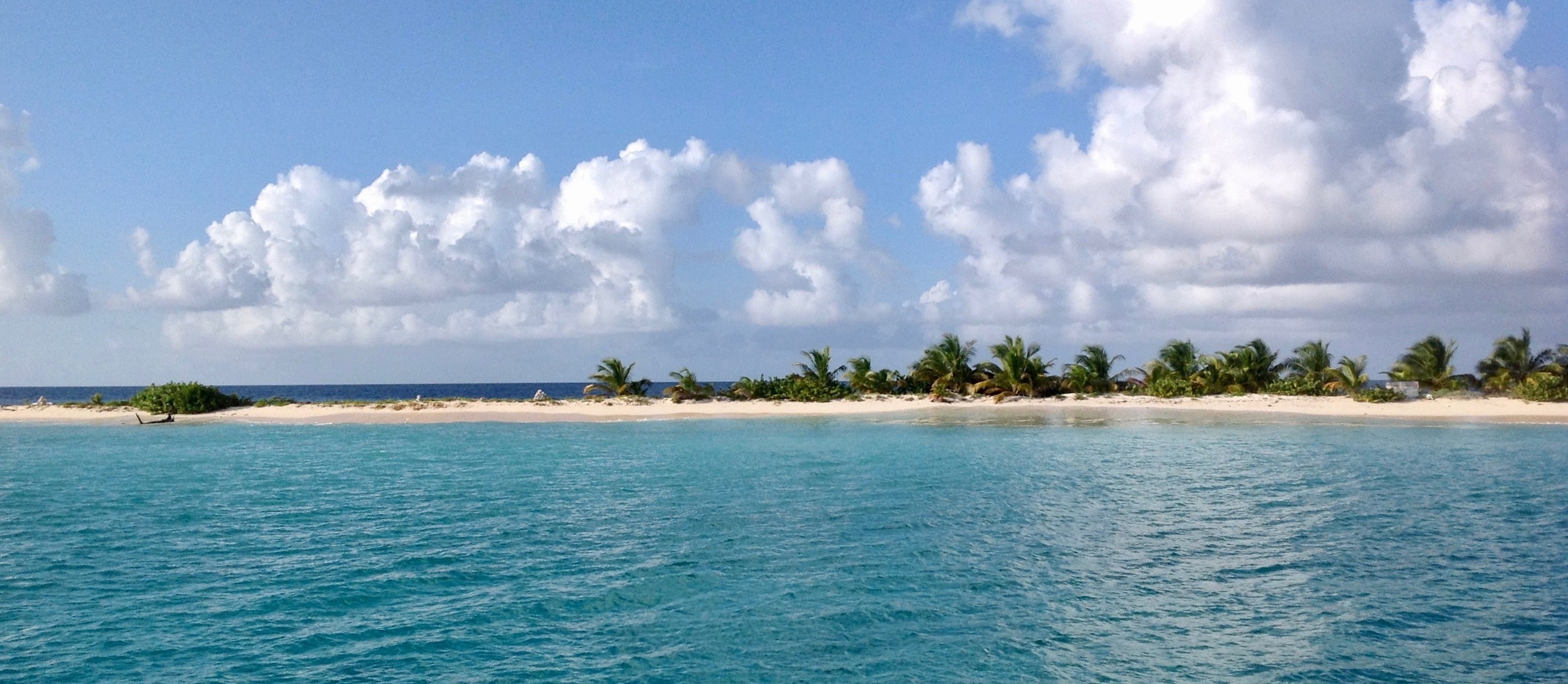 View from sail boat Image of Sandy Island from a sailboat