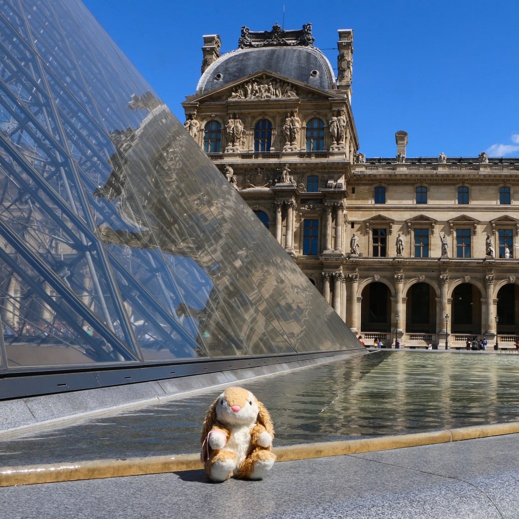 Louvre pyramid Bunny posing at Louvre